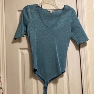 Sparkly teal bodysuit, gently worn, stores in non-smoking home